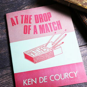 At the Drop of a Match by Ken De Courcy